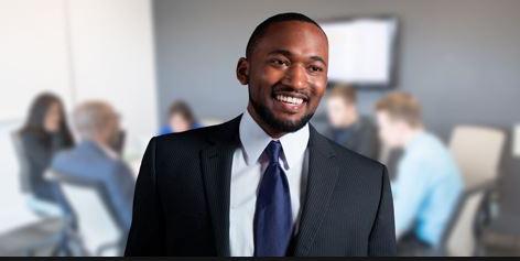 Man standing in front of business meeting