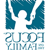 Focus on the Family logo depicting silhouette of child with arms raised holding parents' h和s.